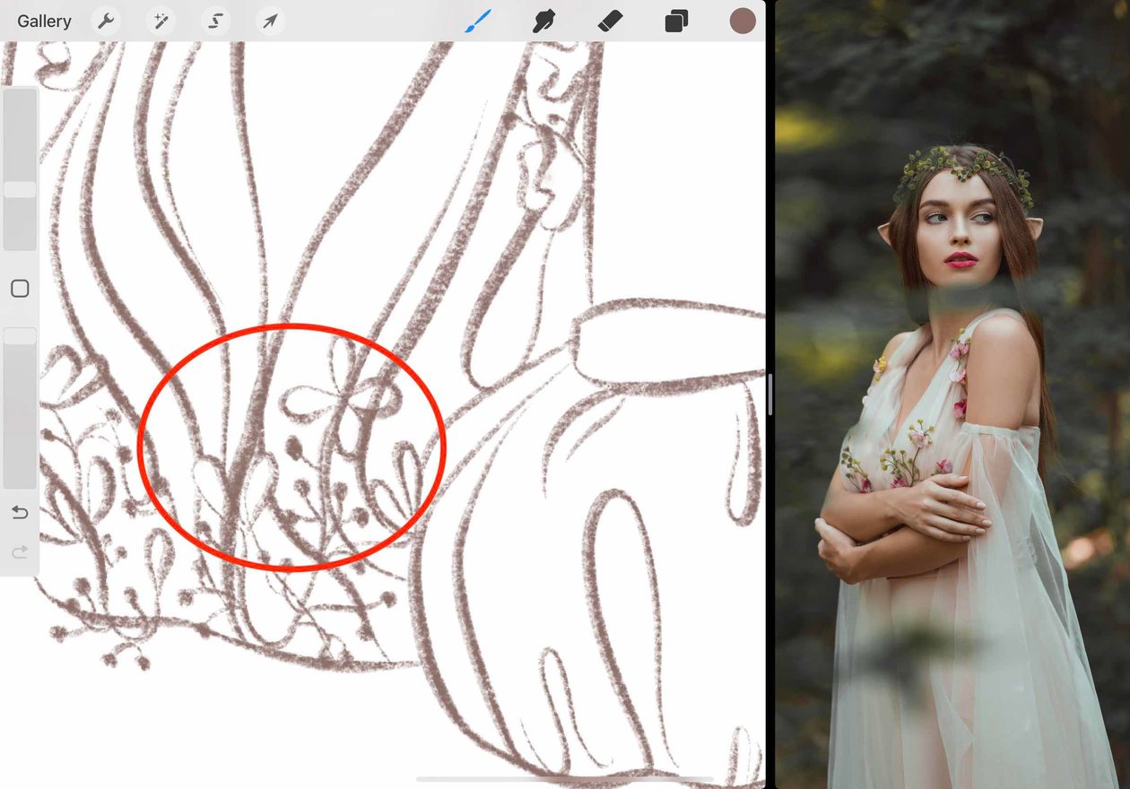 the area where the lines from the dress are overlapping the flowers is circled in red