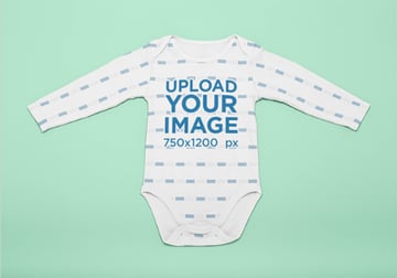 Mockup of a Onesie Laid Flat on a Surface