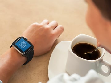Young Lady on Coffee Break Wearing a Black Apple Watch