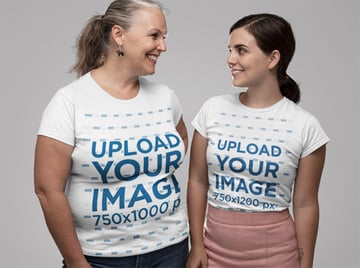 Mockup of Mother and Daughter Wearing a T-Shirt and Looking at Each Other