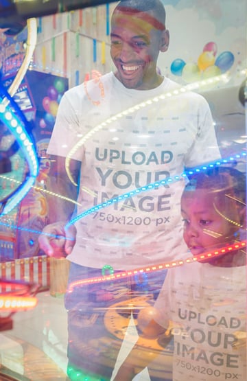 Mockup of a Man Wearing T-Shirts with his Son at the Video Arcade
