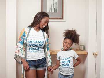T-Shirt Mockup of a Happy Girl at Home with her Mom