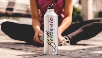 The Aisollya font is one of the best fonts for water bottles. Here's a quick name design featuring it on a mockup from Placeit.
