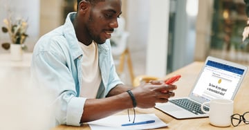 Content creator sitting in office chair attempting to appeal a demonetized video for article that helps users understand what is demonetization on Youtube.
