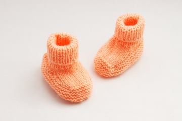 Final image of the baby boots shot using a light tent