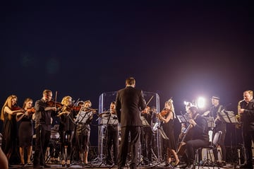 Musical ensemble performing live concert at night