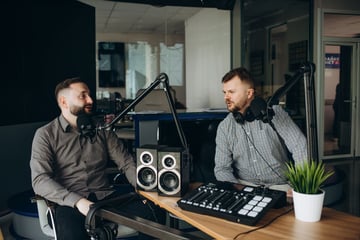 two men podcasting in a studio