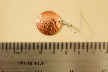Test image of an earring with a ruler underneath for measurement