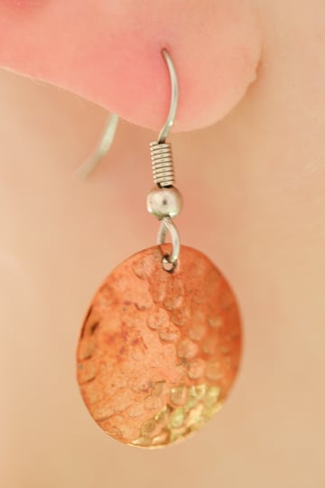 Close-up photo of earring on models ear