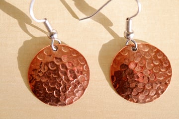 Earrings in harsh sunlight