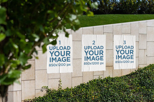 Mockup of Three Paper Posters on a Wall