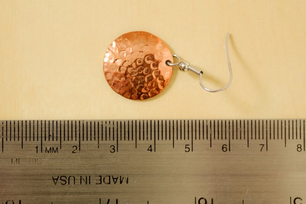 Test image of an earring with a ruler underneath for measurement