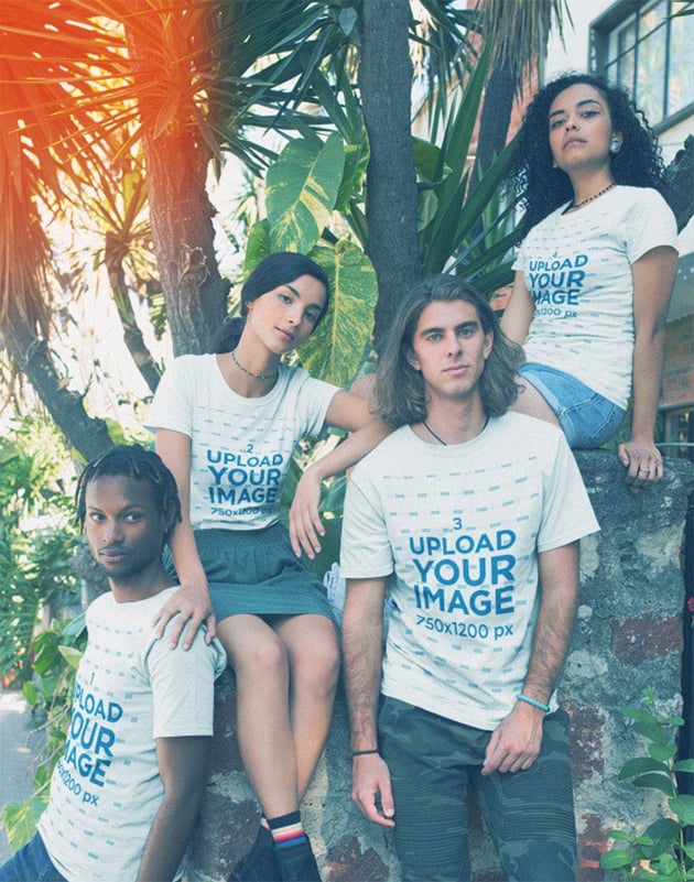 Group Wearing T-Shirts Mockup Near Plants