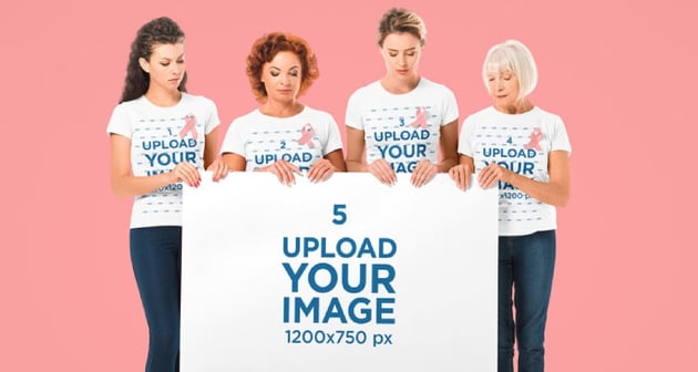 T-Shirt Mockup of Four Women Holding a Big Poster for Cancer Awareness