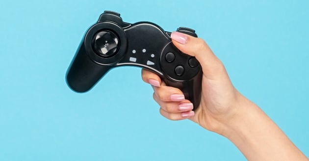 Blue Screen Back Drop Behind Hand Holding Controller