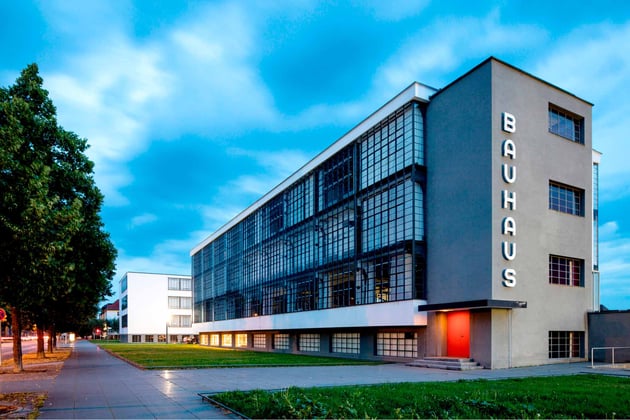 Historic Bauhaus school building featuring vertical lettering and International Style design