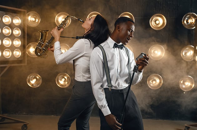Male jazz performer and female saxophonist