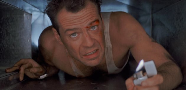 McClane crawls through an air vent with a lighter