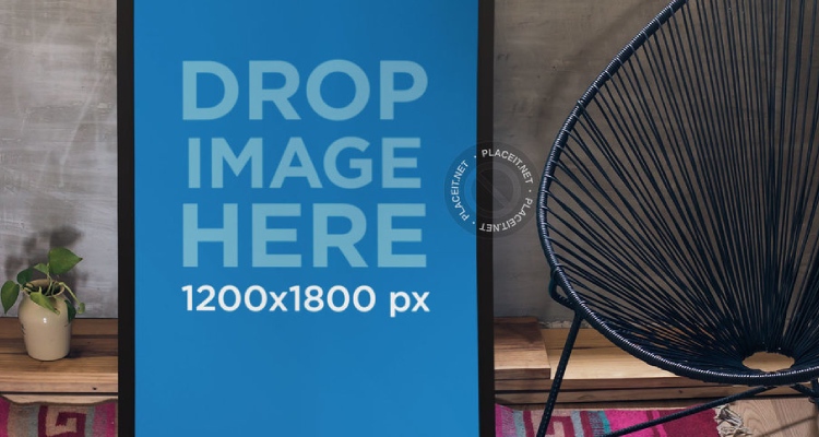 Poster Mockup Leaning Against a Wall in a Stylish Living Room