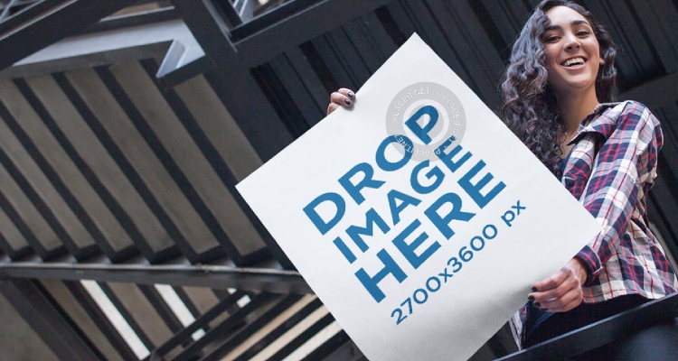 Young Woman Showing a Big Poster From Above Mockup