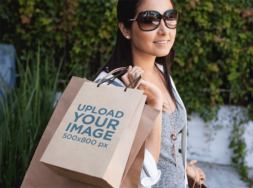 Paper Bag Mockup of a Woman Carrying a Set of Shopping Bags