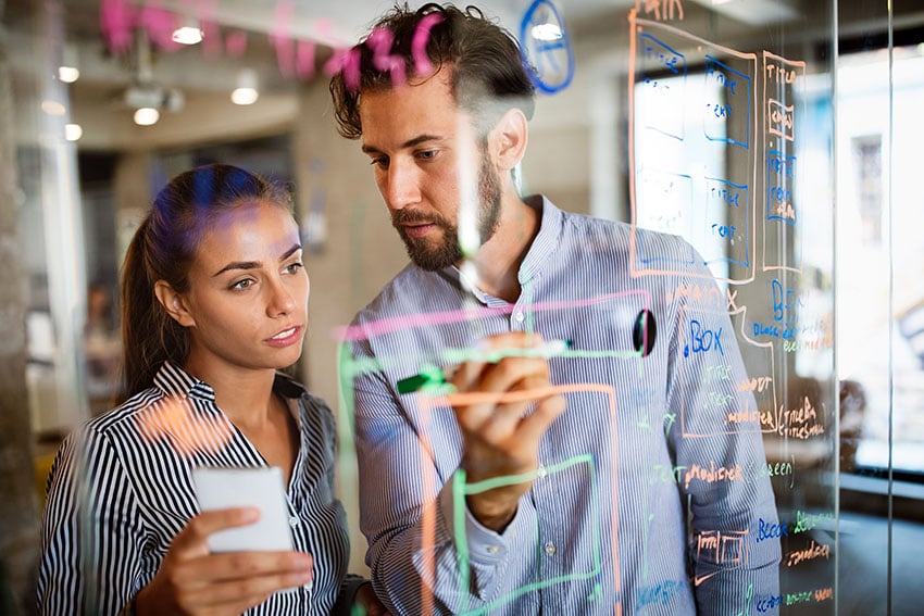 Collaboration and analysis by business people working in office