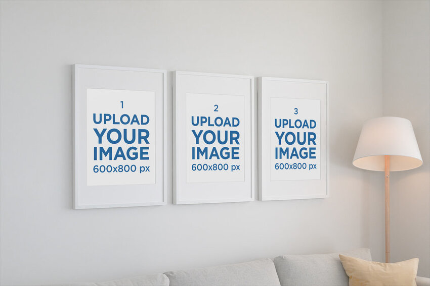 Mockup of Three Poster Frames Hanging on a Living Room Wall