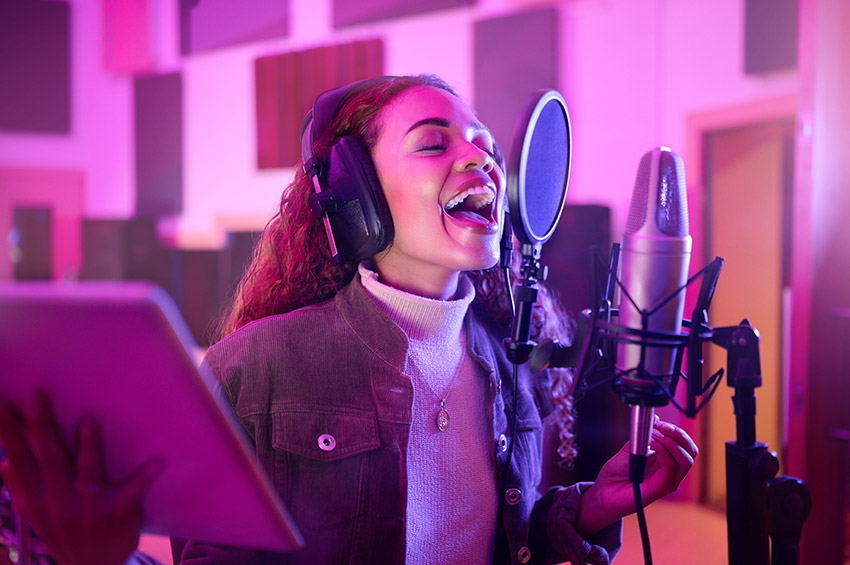 woman on neon microphone